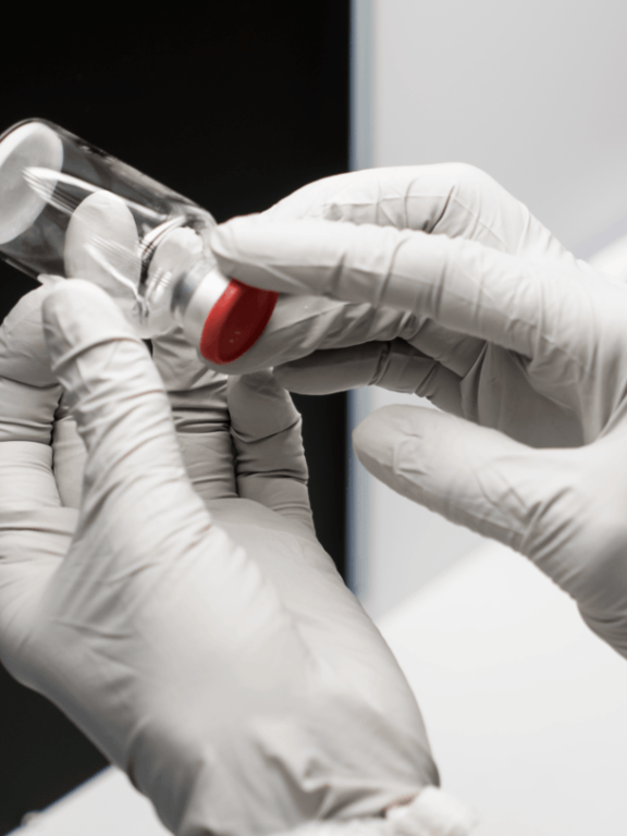 Pre-filled syringe examined by manufacturing technician
