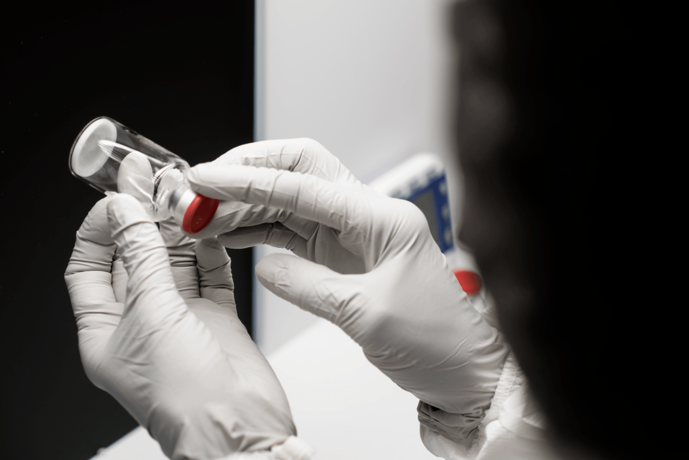 Pre-filled syringe examined by manufacturing technician