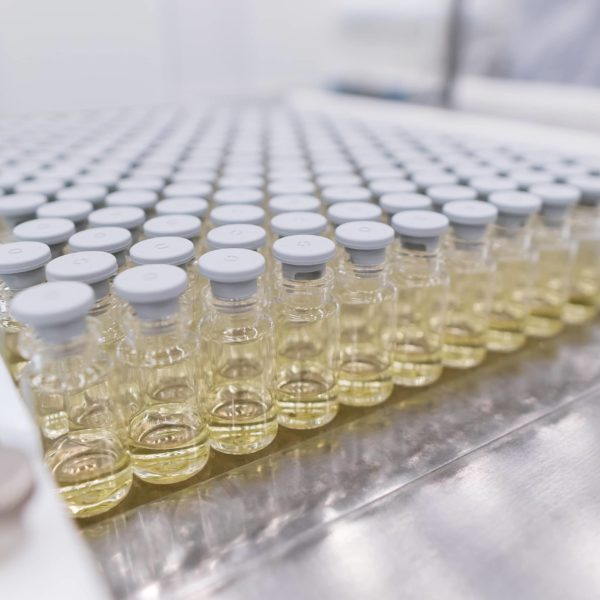 Aseptically filled vials prepared in trays for lyophilization