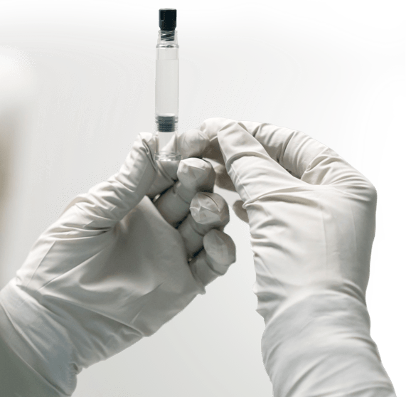 Vial in gloved hand